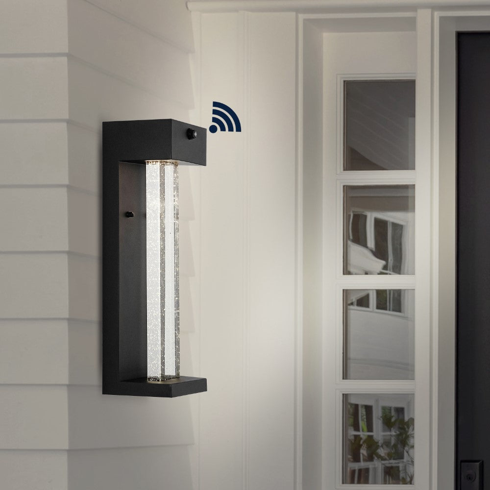 Turbo 5.13" Modern Industrial Iron/Glass Seeded Glass with Dusk-to-Dawn Sensor Integrated LED Outdoor Sconce