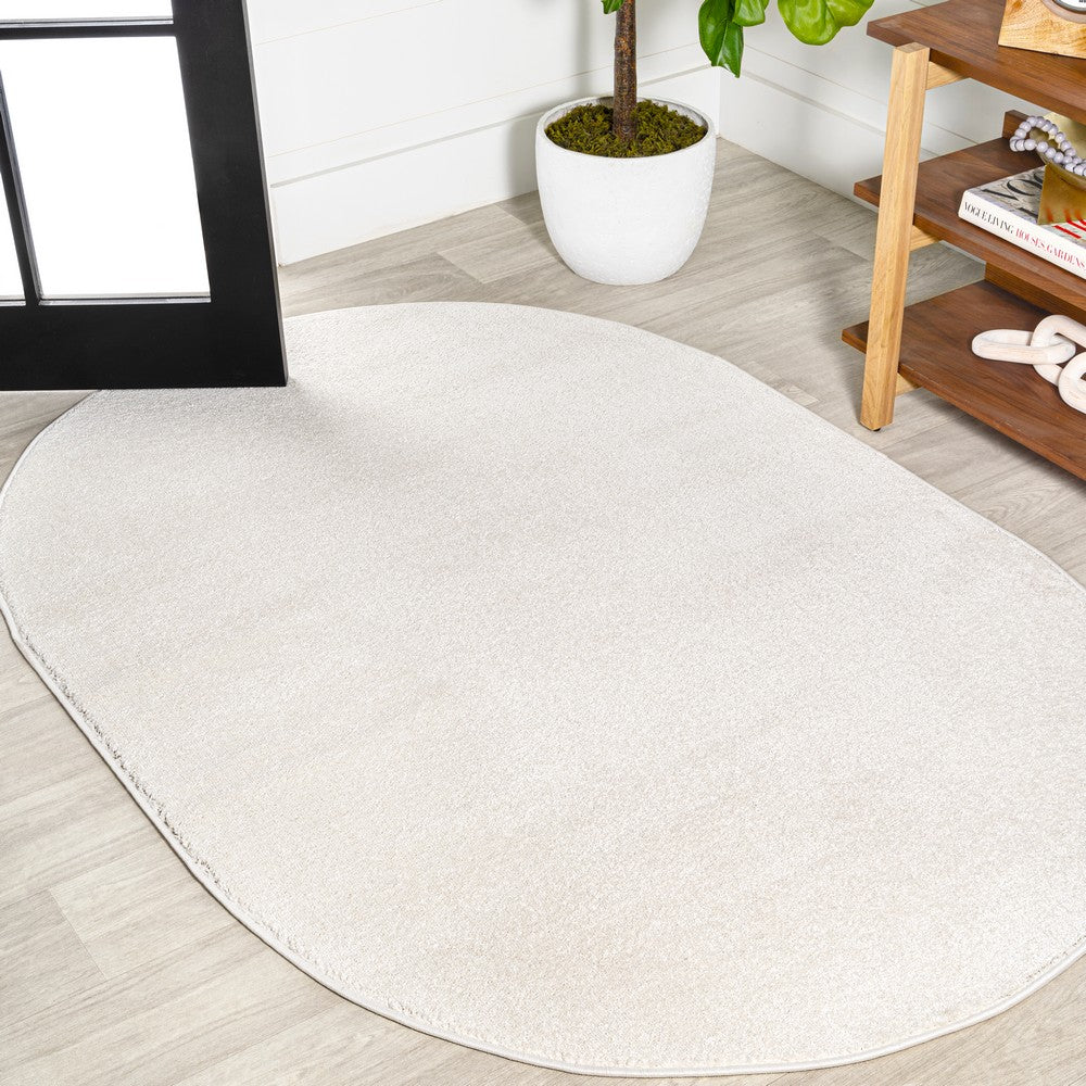 Trivor Haze Solid Low-pile Area Rug Cream