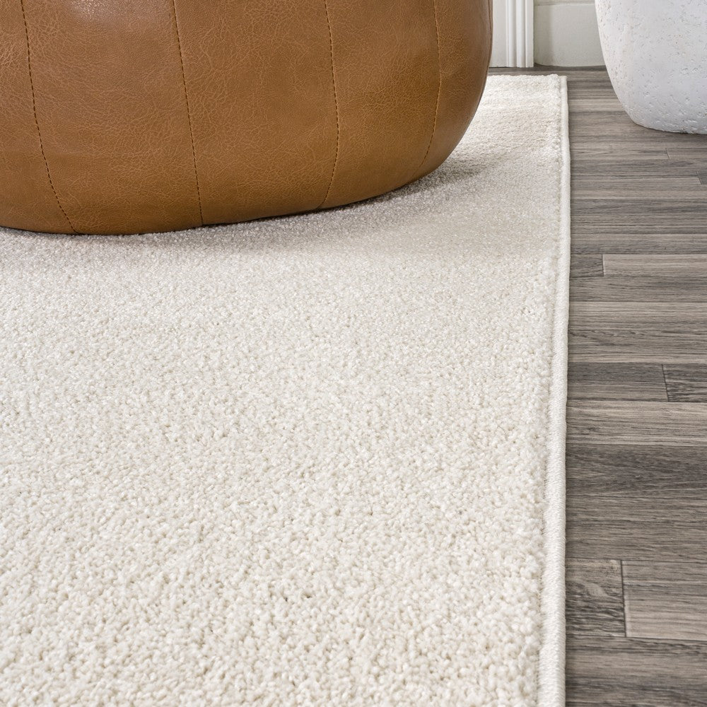 Trivor Haze Solid Low-pile Area Rug Cream