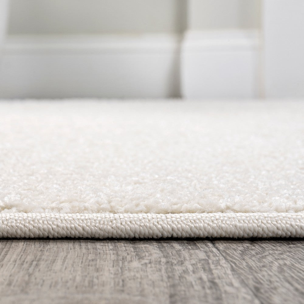 Trivor Haze Solid Low-pile Area Rug Cream