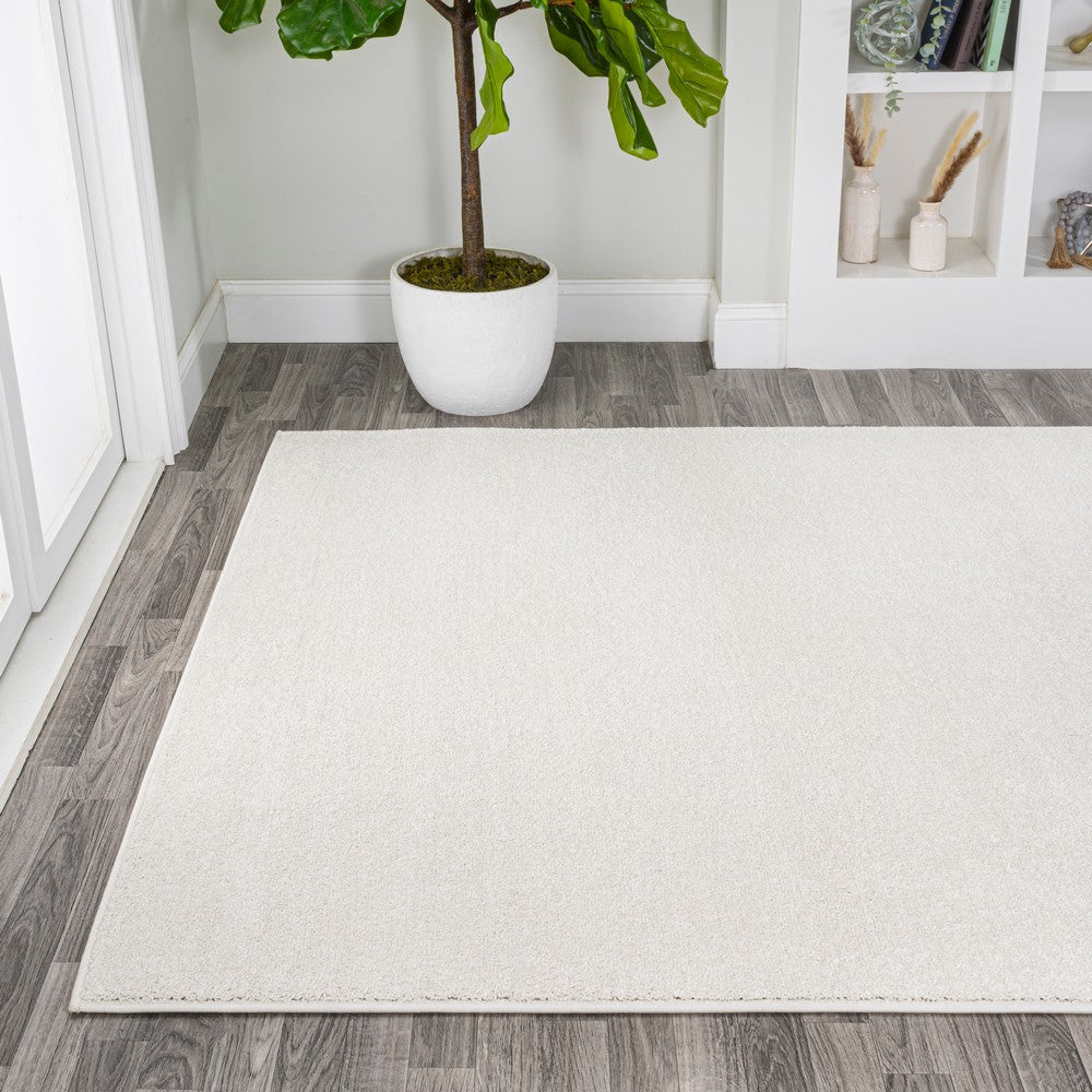 Trivor Haze Solid Low-pile Area Rug Cream