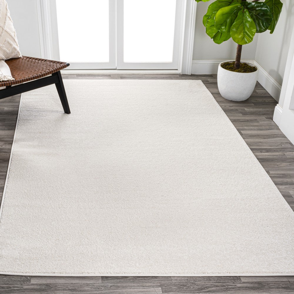 Trivor Haze Solid Low-pile Area Rug Cream