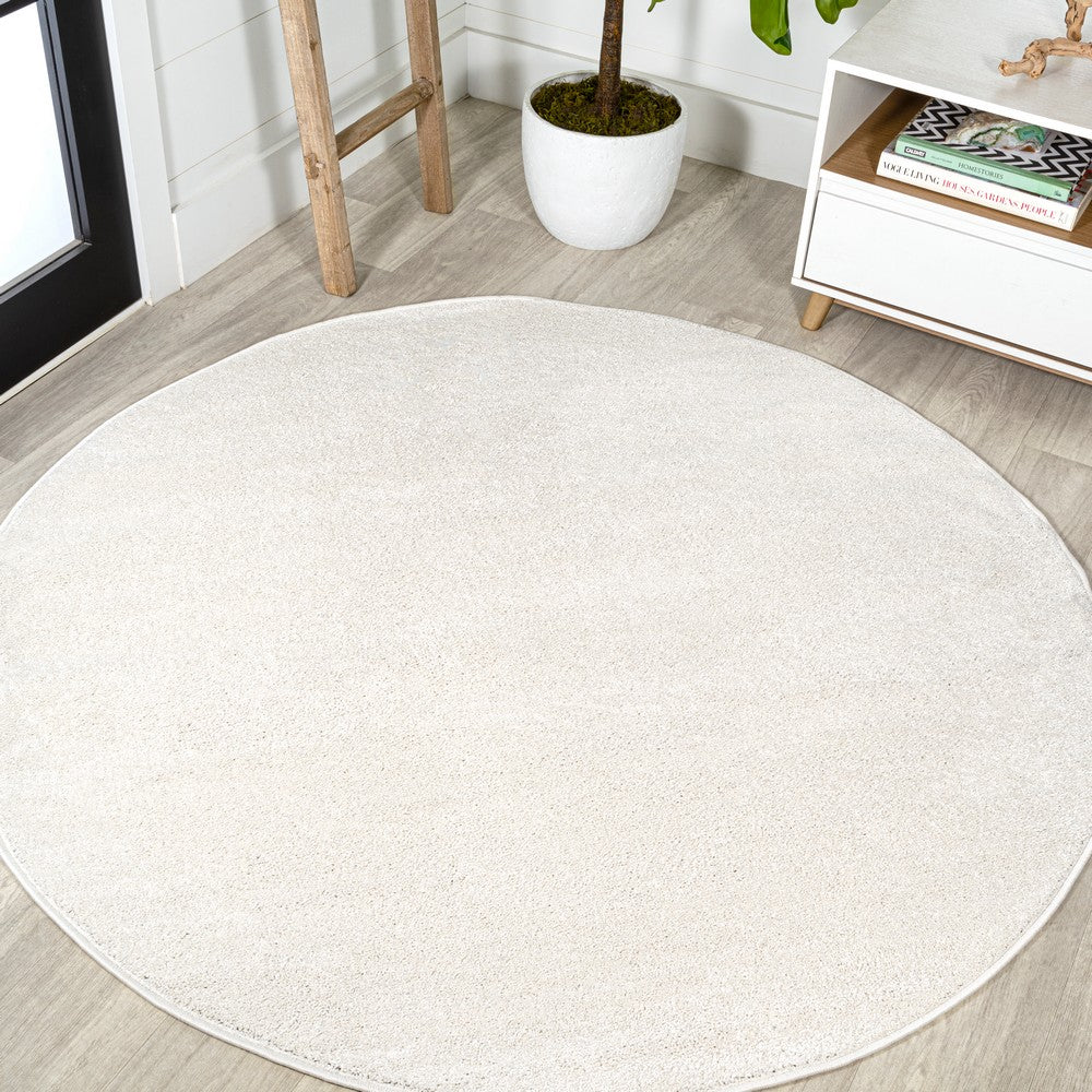 Trivor Haze Solid Low-pile Area Rug Cream