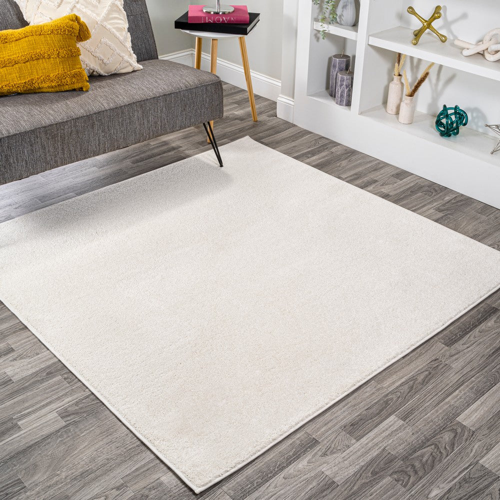 Trivor Haze Solid Low-pile Area Rug Cream