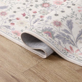 Norvyn Art Nouveau Floral Border Machine-washable Area Rug