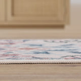 Norvyn Art Nouveau Floral Border Machine-washable Area Rug