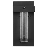 Tremillo 5.5" Minimalist Industrial Iron/Glass Seeded Glass with Dusk-to-Dawn Sensor Integrated LED Outdoor Sconce