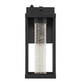 Shoji 4.75" Industrial Vintage Iron/Glass Seeded Glass with Dusk-to-Dawn Sensor Integrated LED Outdoor Sconce