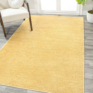 Trivor Haze Solid Low-Pile Area Rug Mustard