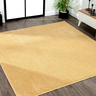 Trivor Haze Solid Low-Pile Area Rug Mustard