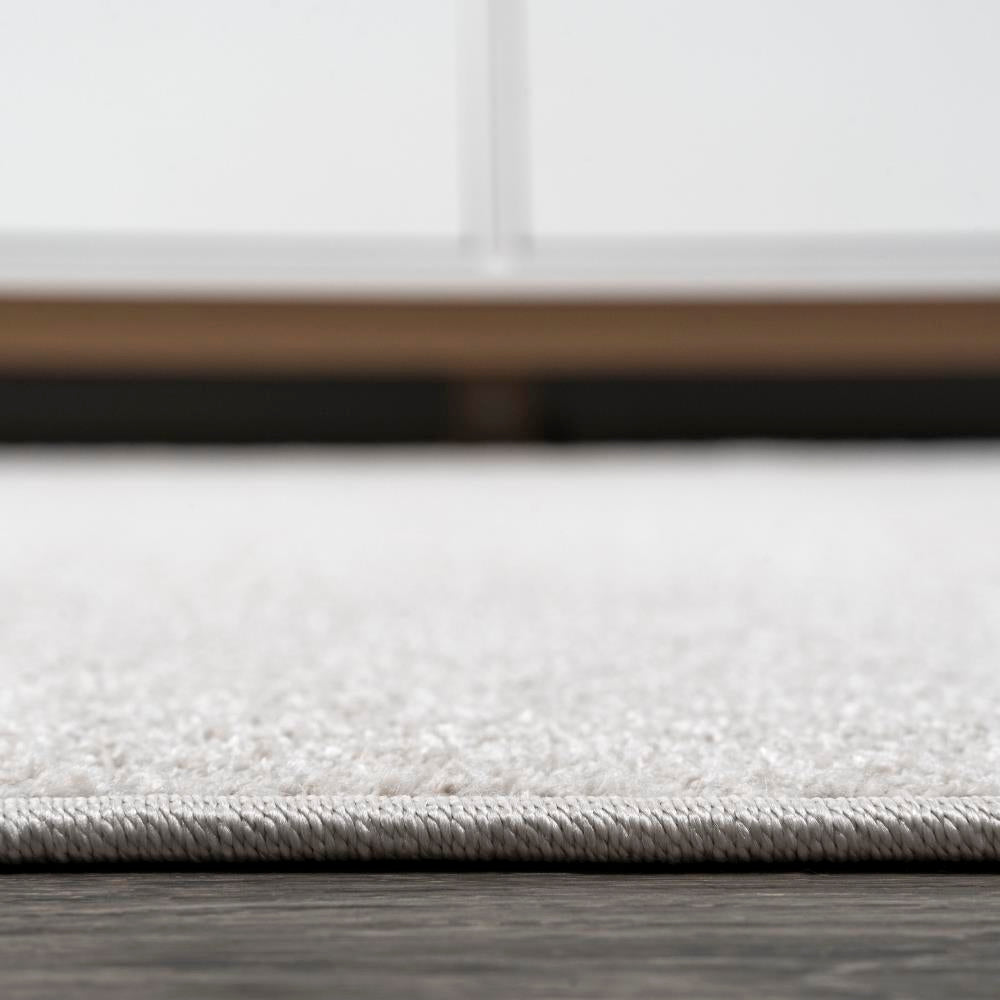 Trivor Haze Solid Low-Pile Area Rug Ivory