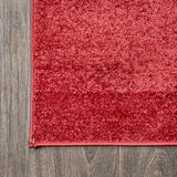 Trivor Haze Solid Low-Pile Area Rug Red