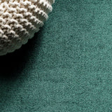 Trivor Haze Solid Low-pile Area Rug Emerald