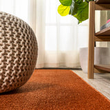 Trivor Haze Solid Low-pile Area Rug Orange
