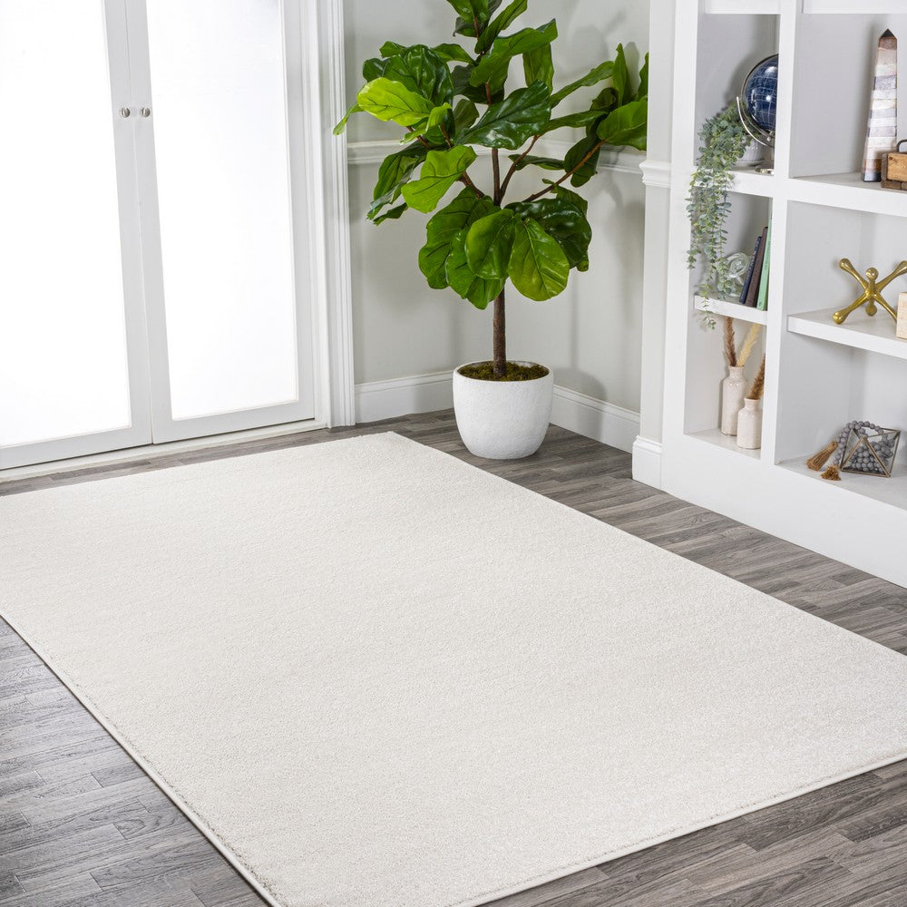Trivor Haze Solid Low-pile Area Rug Cream